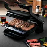 Tefal GC 7128 Optigrill+ Elektro-Kontaktgrill mit 2000W & 6 Grillprogrammen für 89,99€ inkl. Versand (statt 103€)